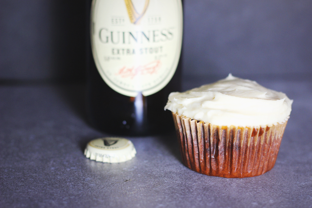 guinness black and tan cupcake next to a bottle of guinness