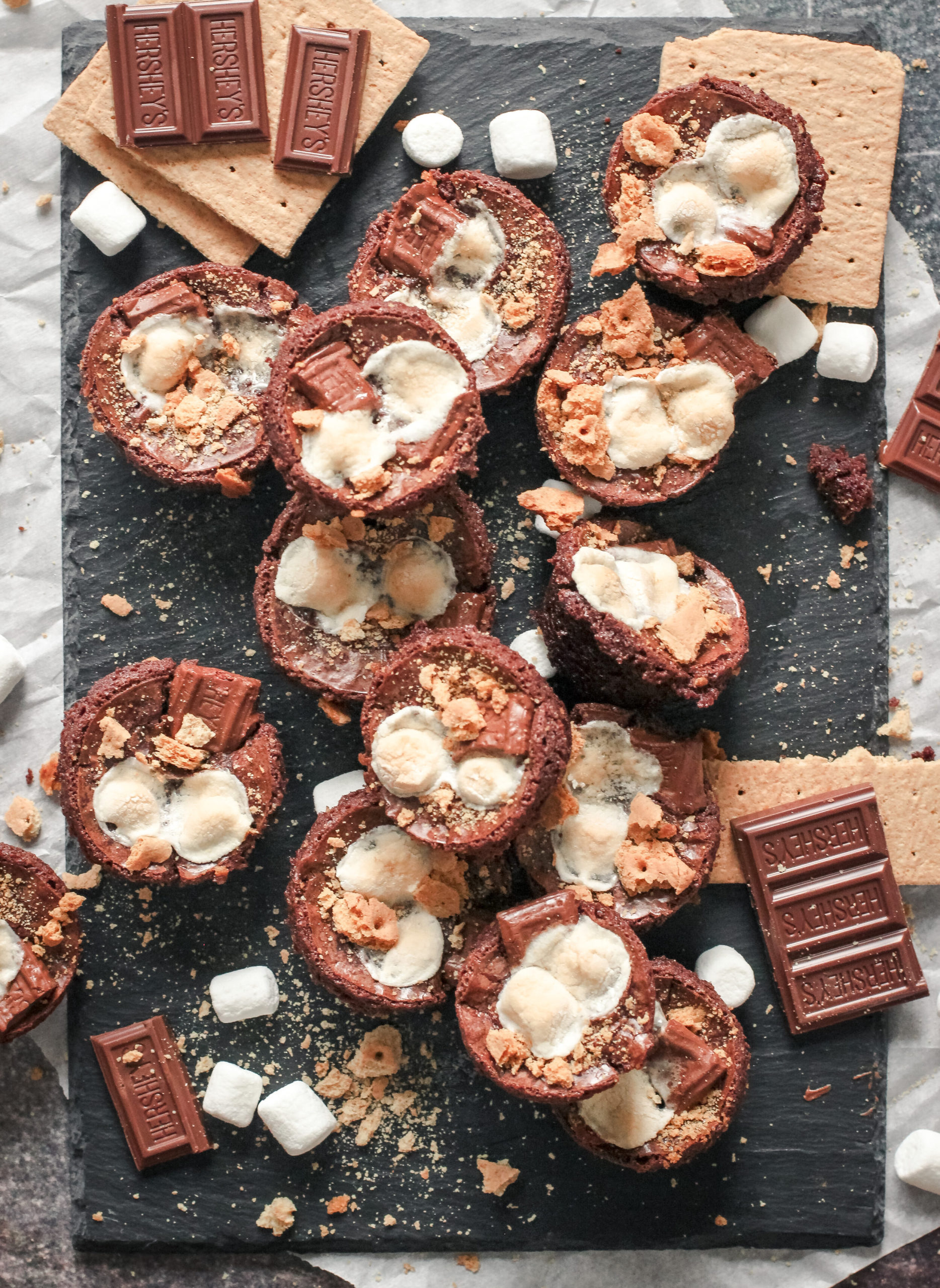 Overhead view of brownie bites, graham crackers, marshmallows and chocolate