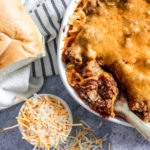 overhead view of a baking dish with creamy baked spaghetti