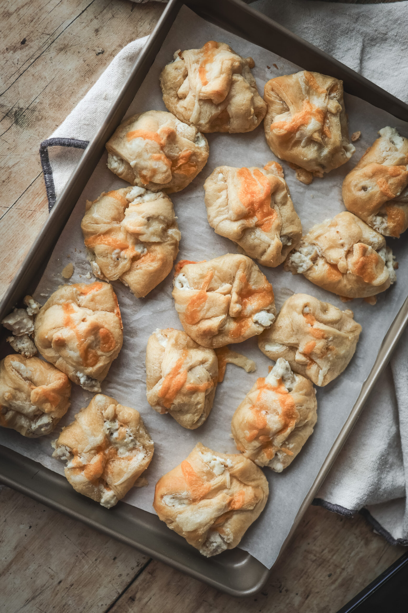 Overhead shot of a serving bow2l filled with chicken puff pastries filled with cream chicken mixture and cheese.