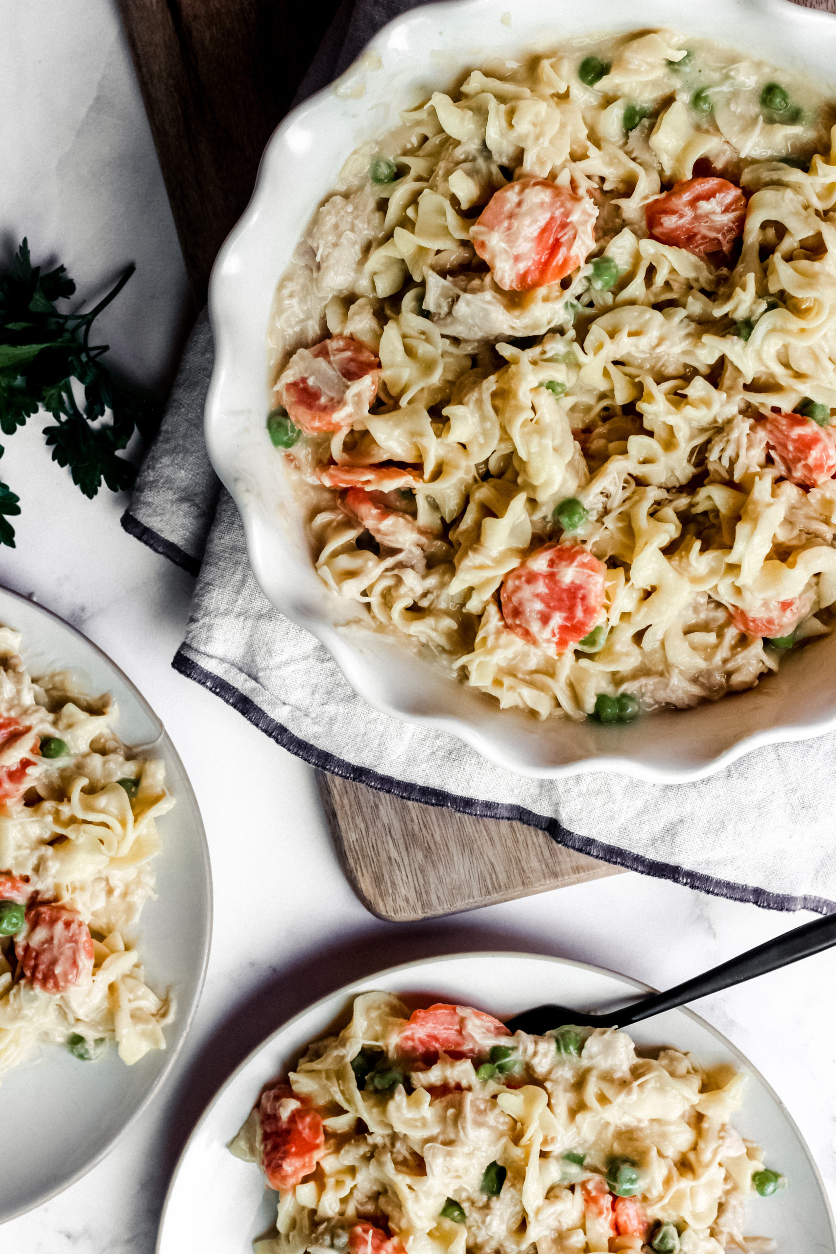overhead shot of a large bowl of creamy chicken and noodles