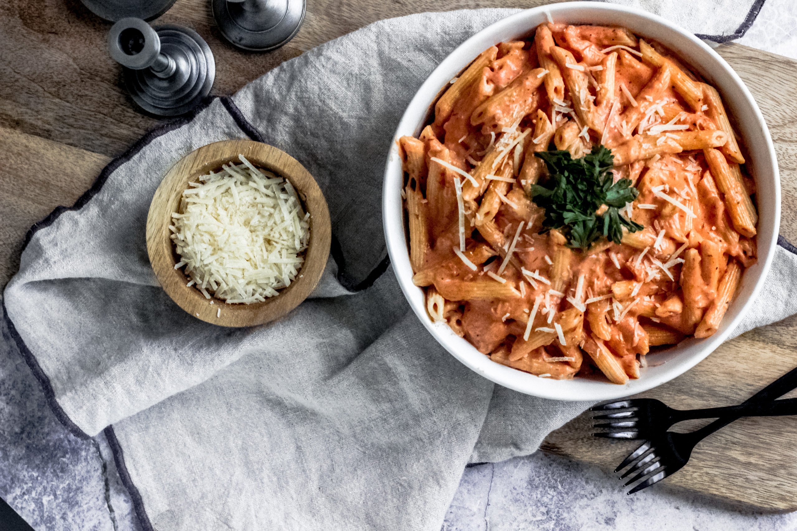 Overhead view of a bowl of cheesy tomato ziti pasta