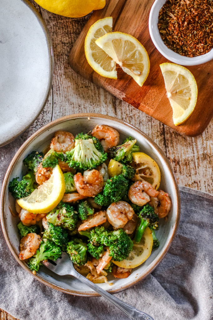 overhead view of a plate of garlic shrimp with broccoli