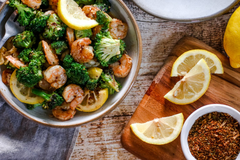 overhead view of a plate of garlic butter shrimp and broccoli