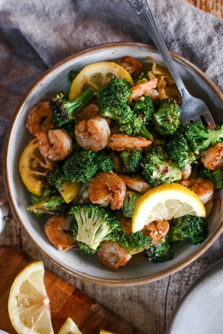 overhead view of a plate of garlic butter shrimp and broccoli