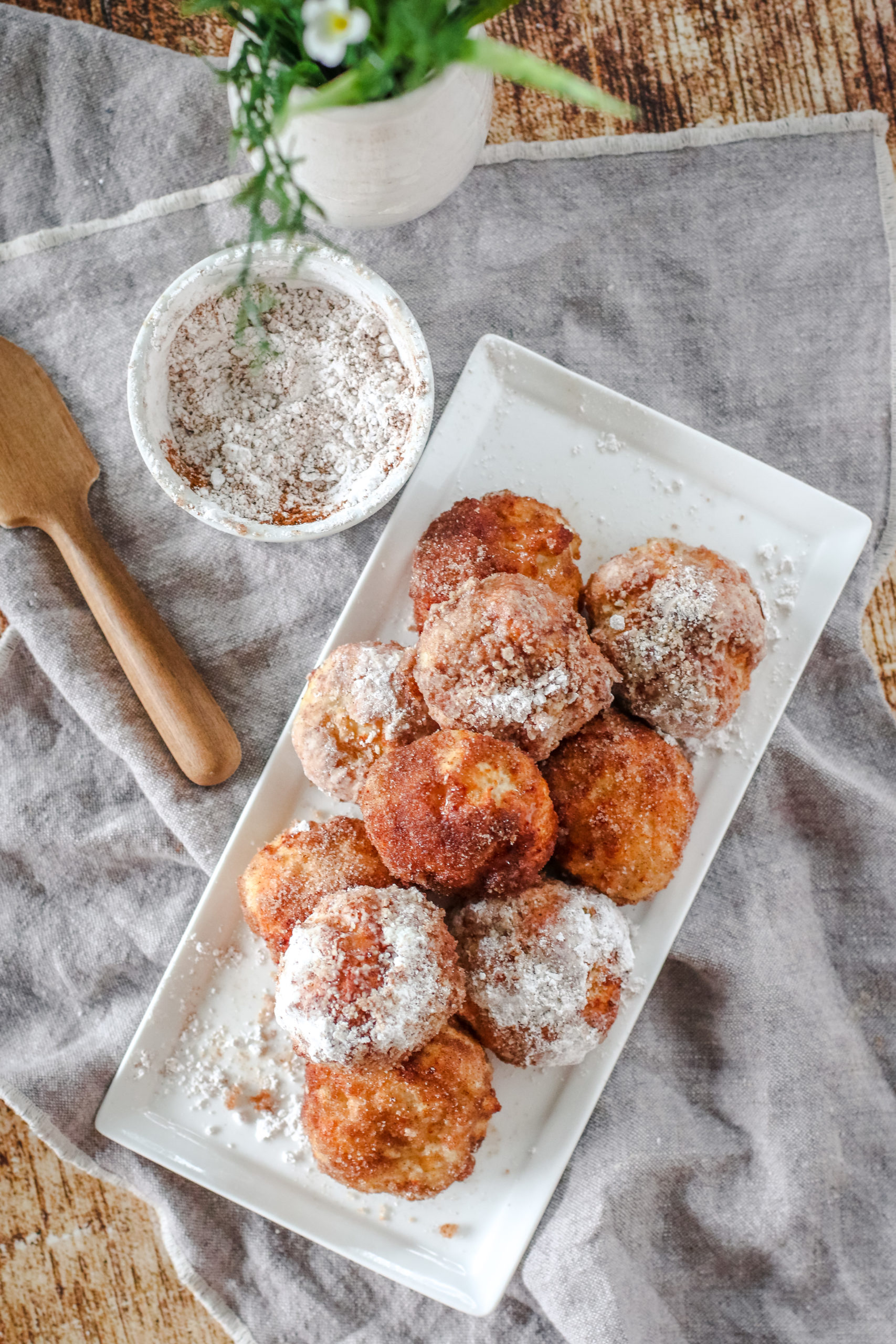 Overhead view of a platter of air fryer cinnamon sugar donuts