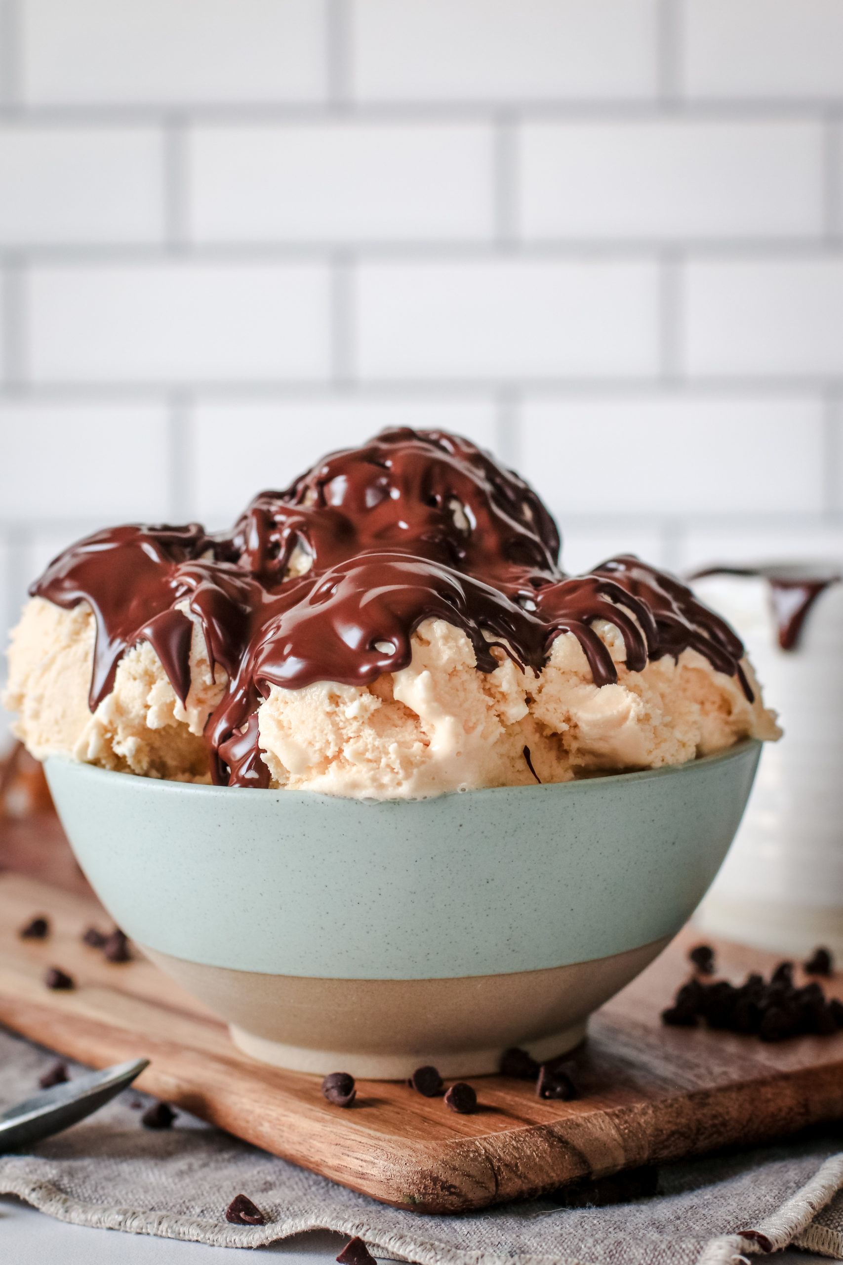 Straight on view of a bowl of ice cream with chocolate magic shell