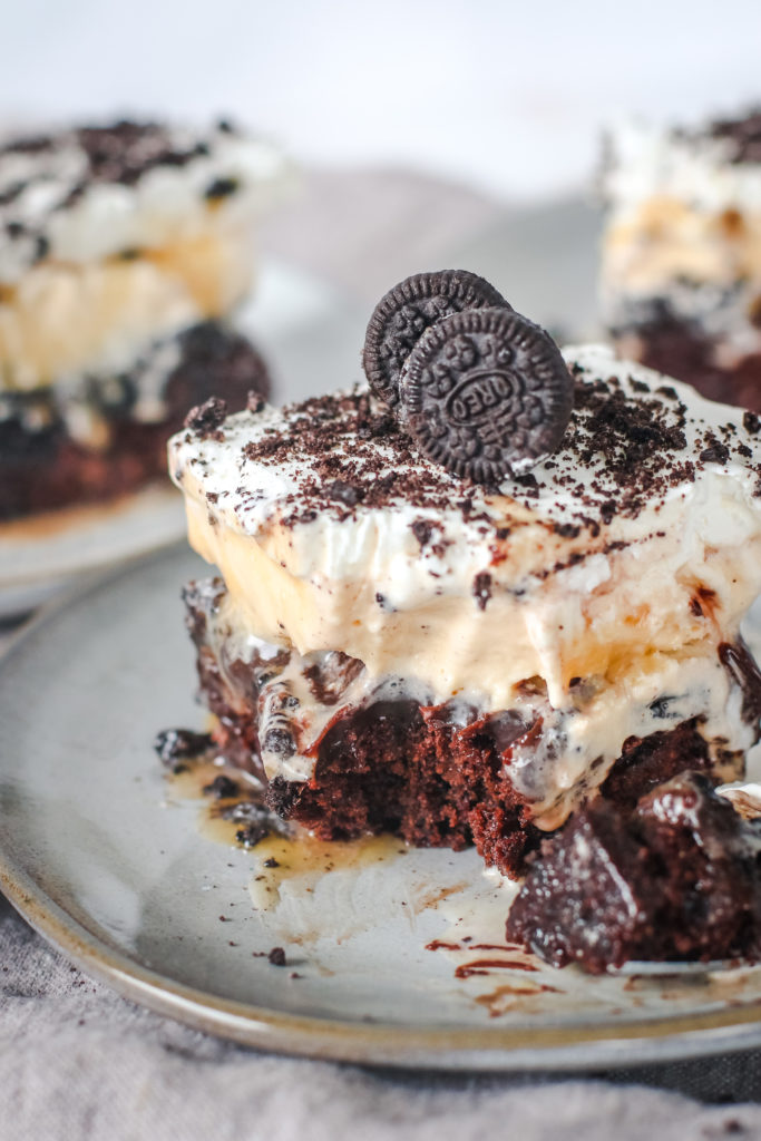 straight on view of a layered brownie ice cream cake