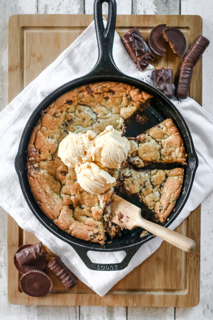 overhead view of a skillet cookie with ice cream scoops
