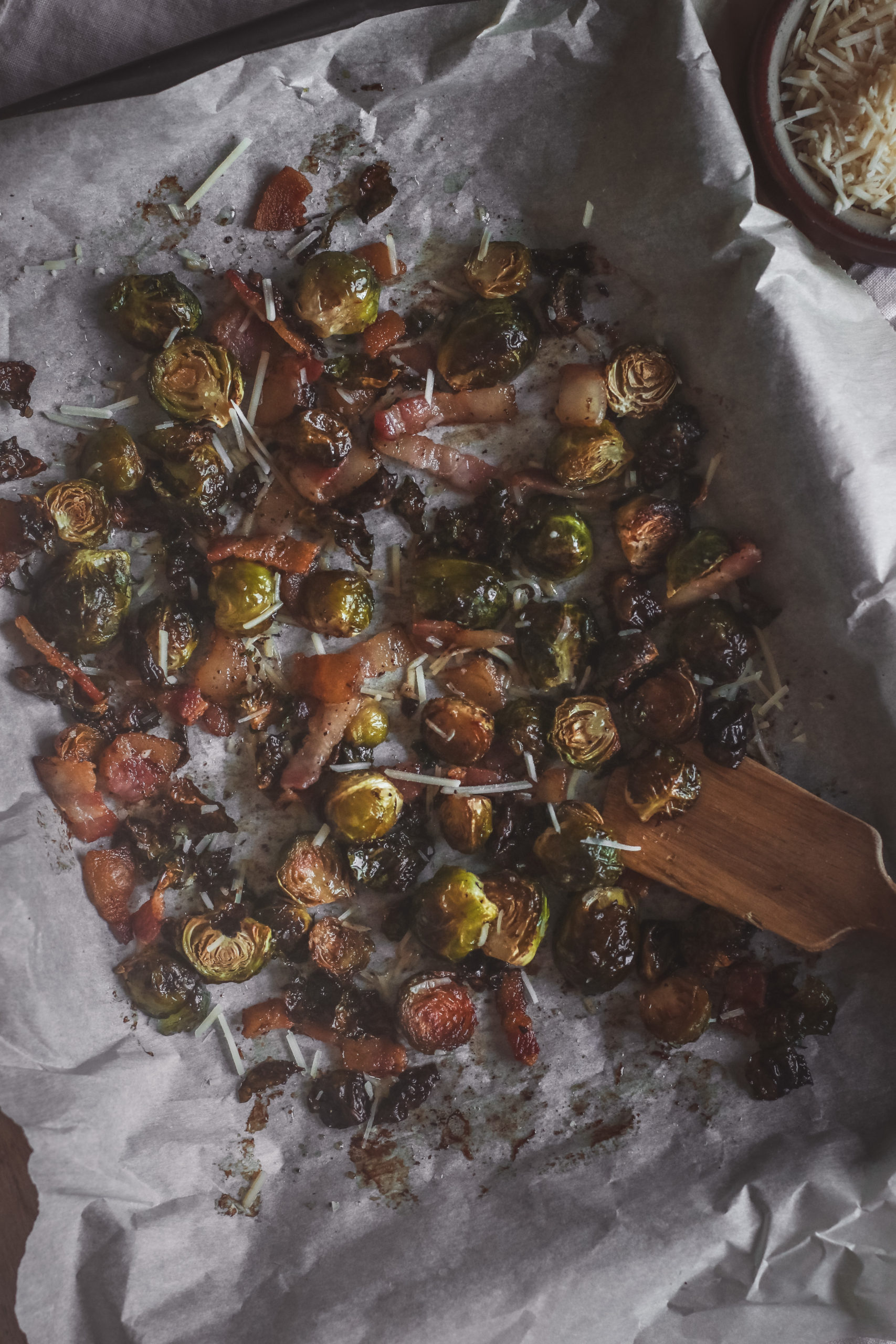 overhead view of a sheet pan of roasted brussels sprouts with bacon