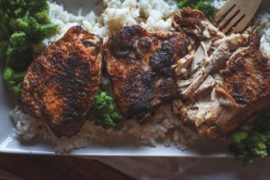 overhead view of a platter of crockpot chicken with rice and veggies