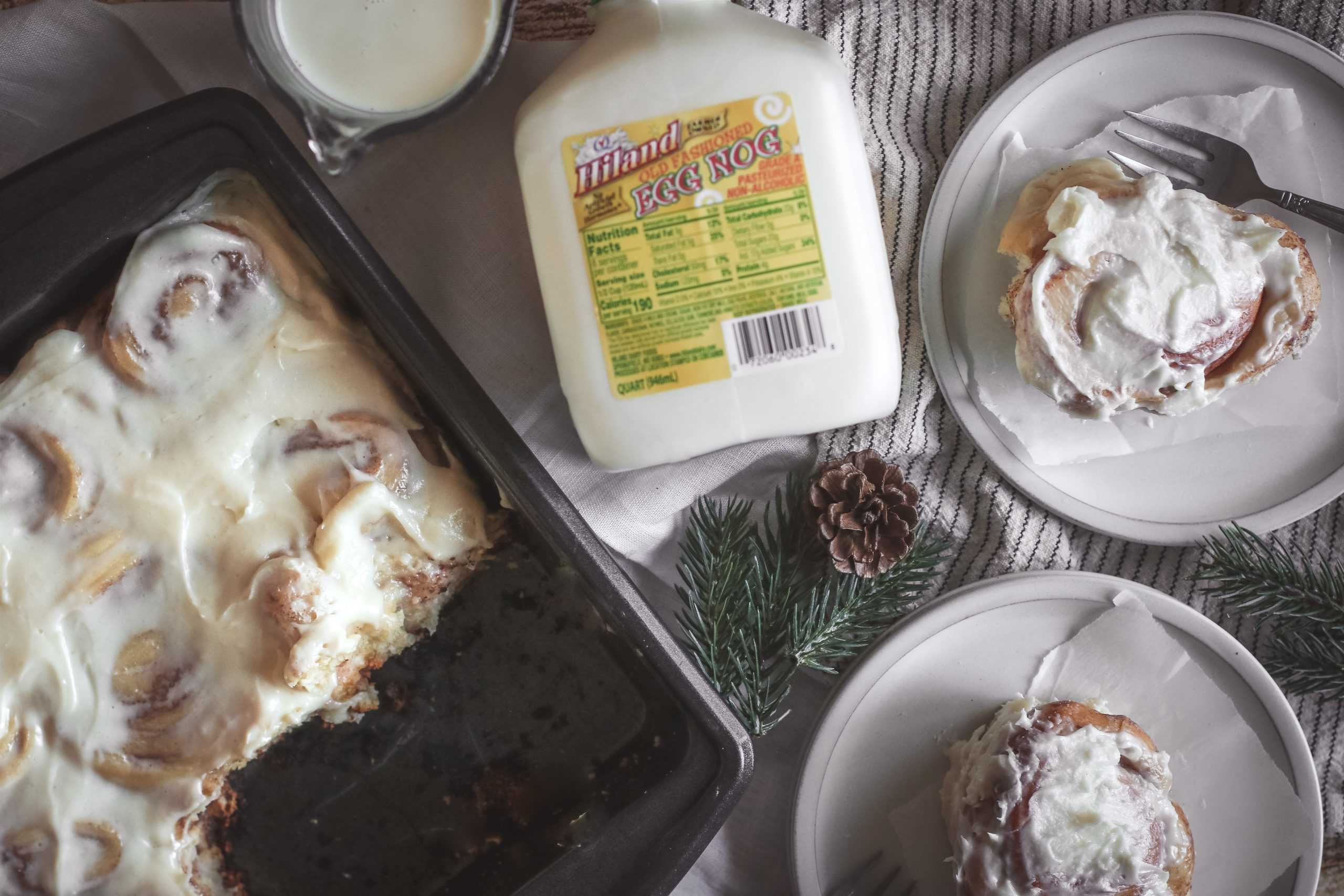 overhead view of a plate of eggnog cinnamon rolls