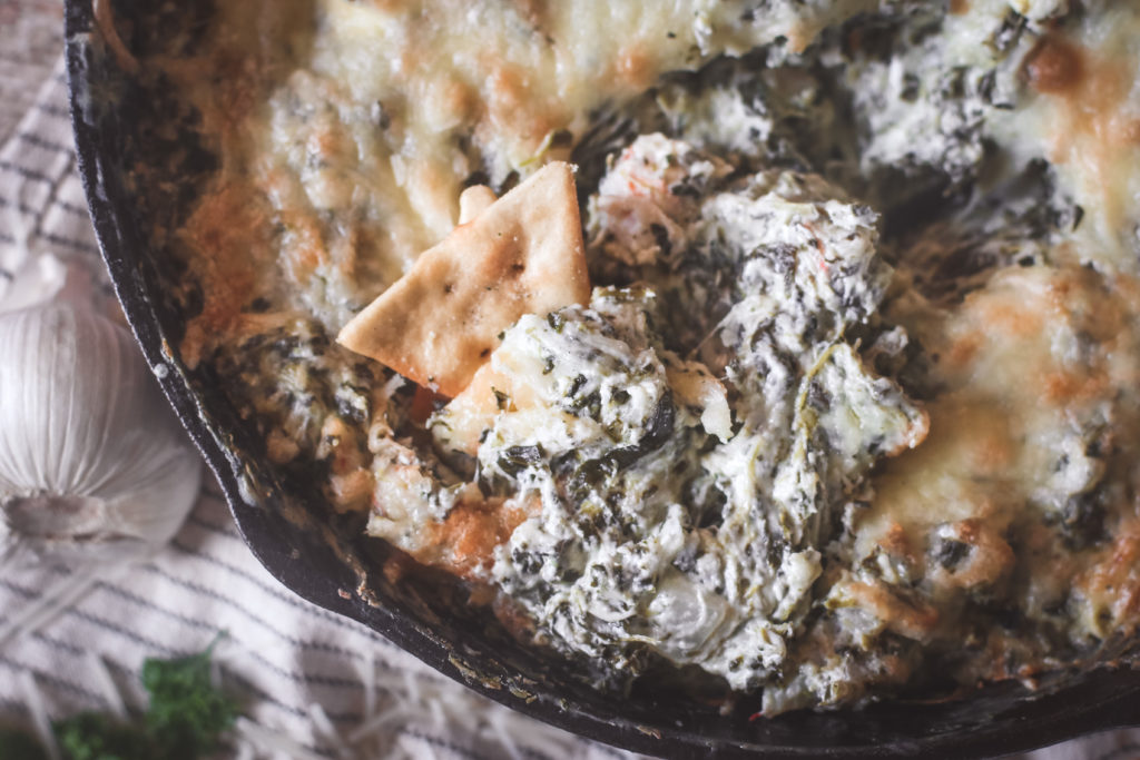 overhead view of a pan of creamy shrimp and spinach dip