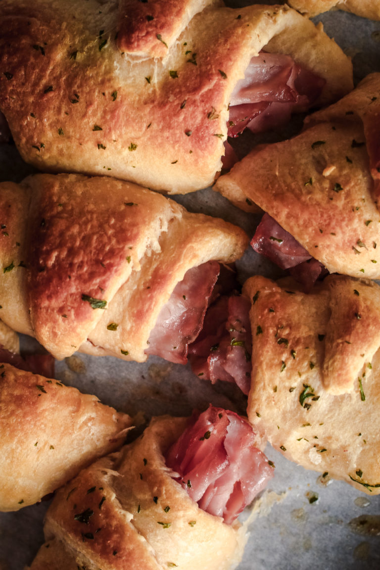 overhead view of a crescent roll ham and cheese roll up