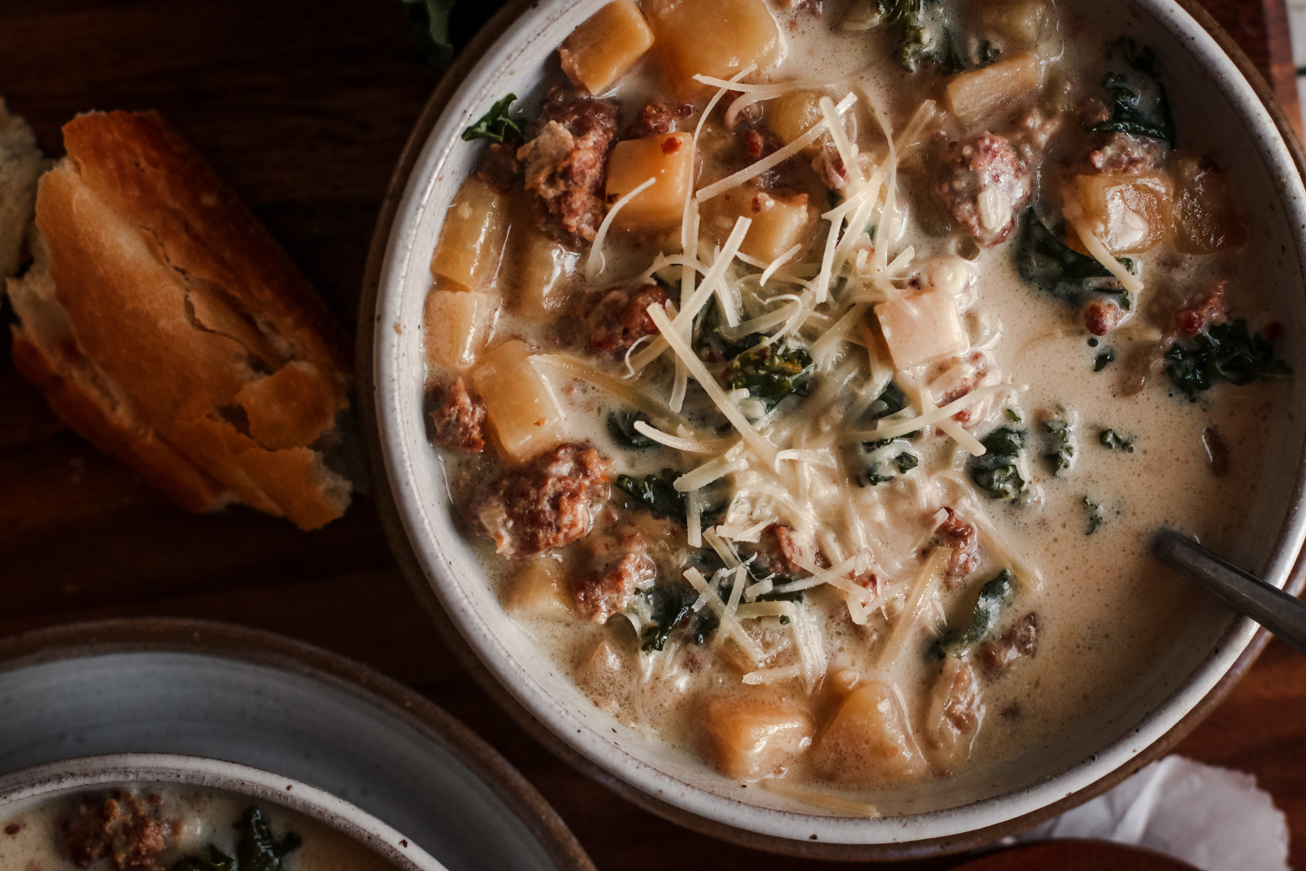 overhead view of a bowl of creamy zuppa toscana soup