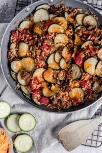 overhead view of a skillet of zucchini and sausage stovetop casserole