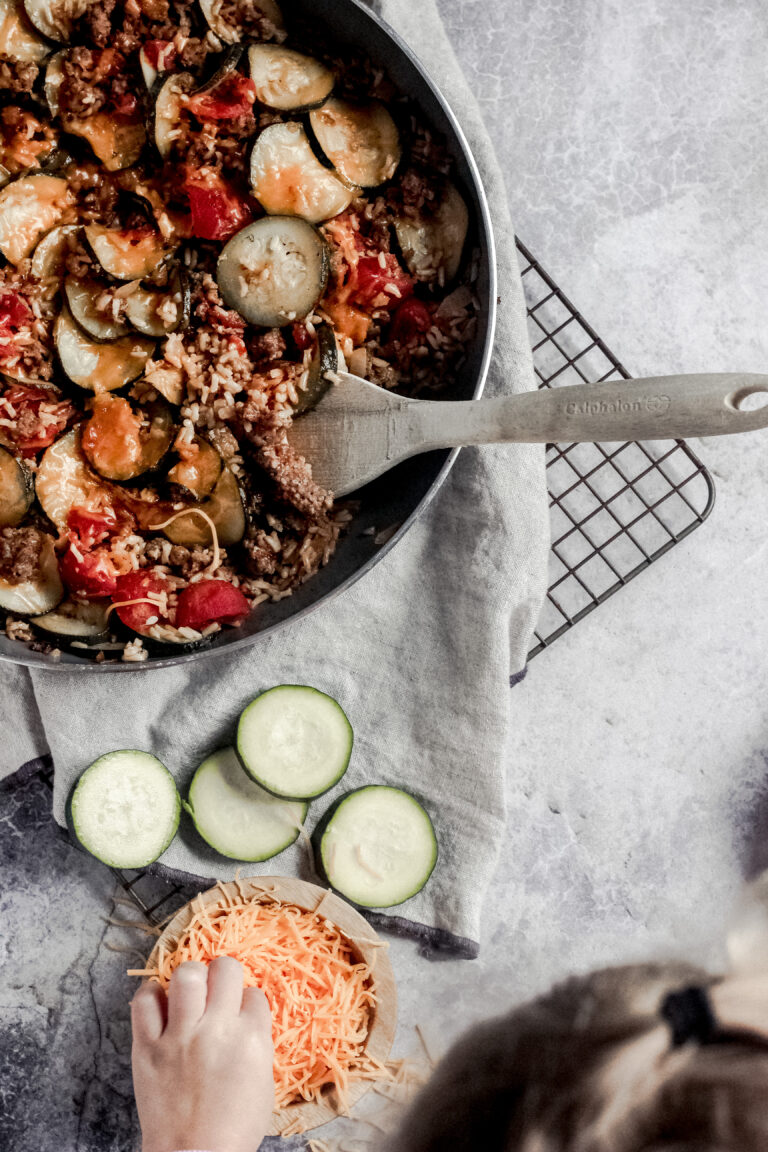 overhead view of a skillet of zucchini and sausage stovetop casserole