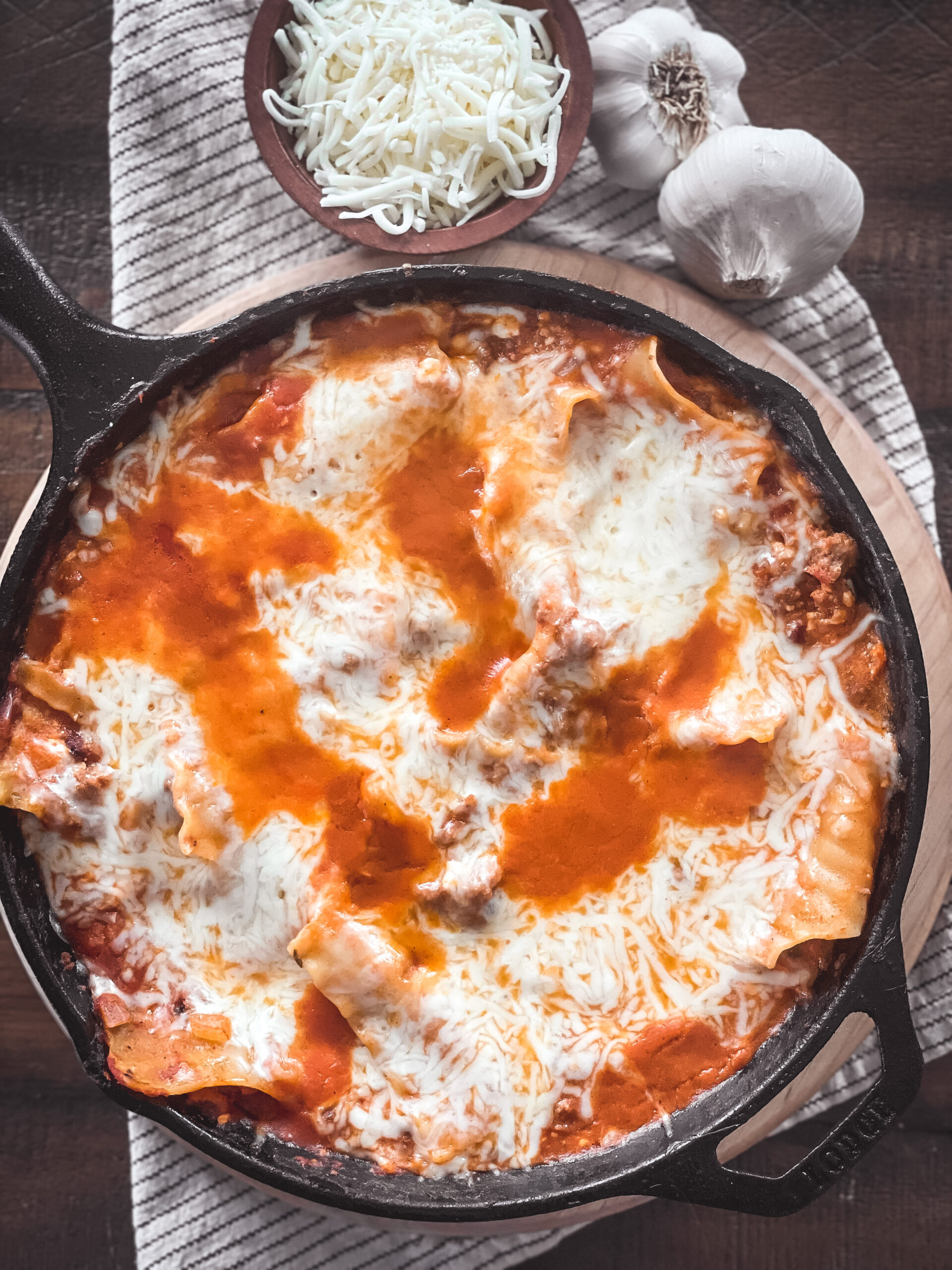 overhead view of a skillet of cheesy lasagna skillet