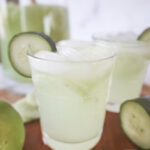 straight on view of a glass of cucumber lime punch