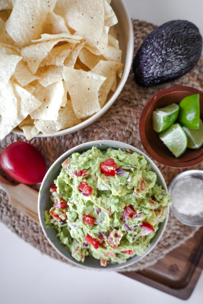overhead view of homemade guacamole with chips