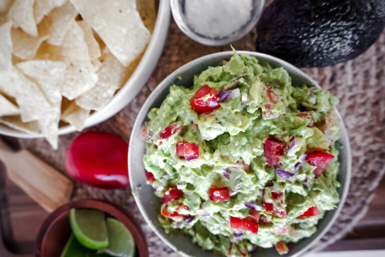 overhead view of homemade guacamole with chips