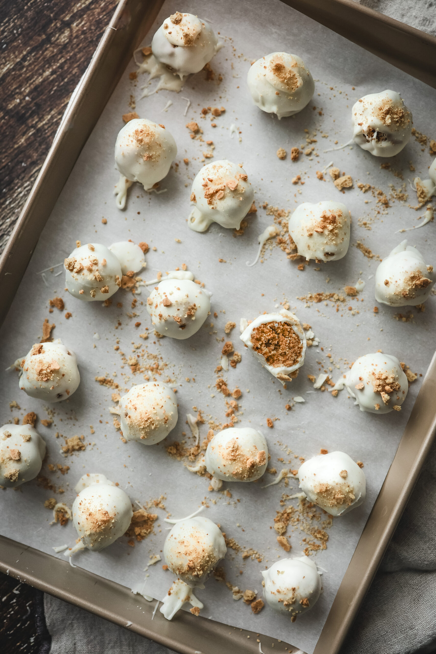 Overhead shot of a tray of pumpkin spice truffles covered in white chocolate