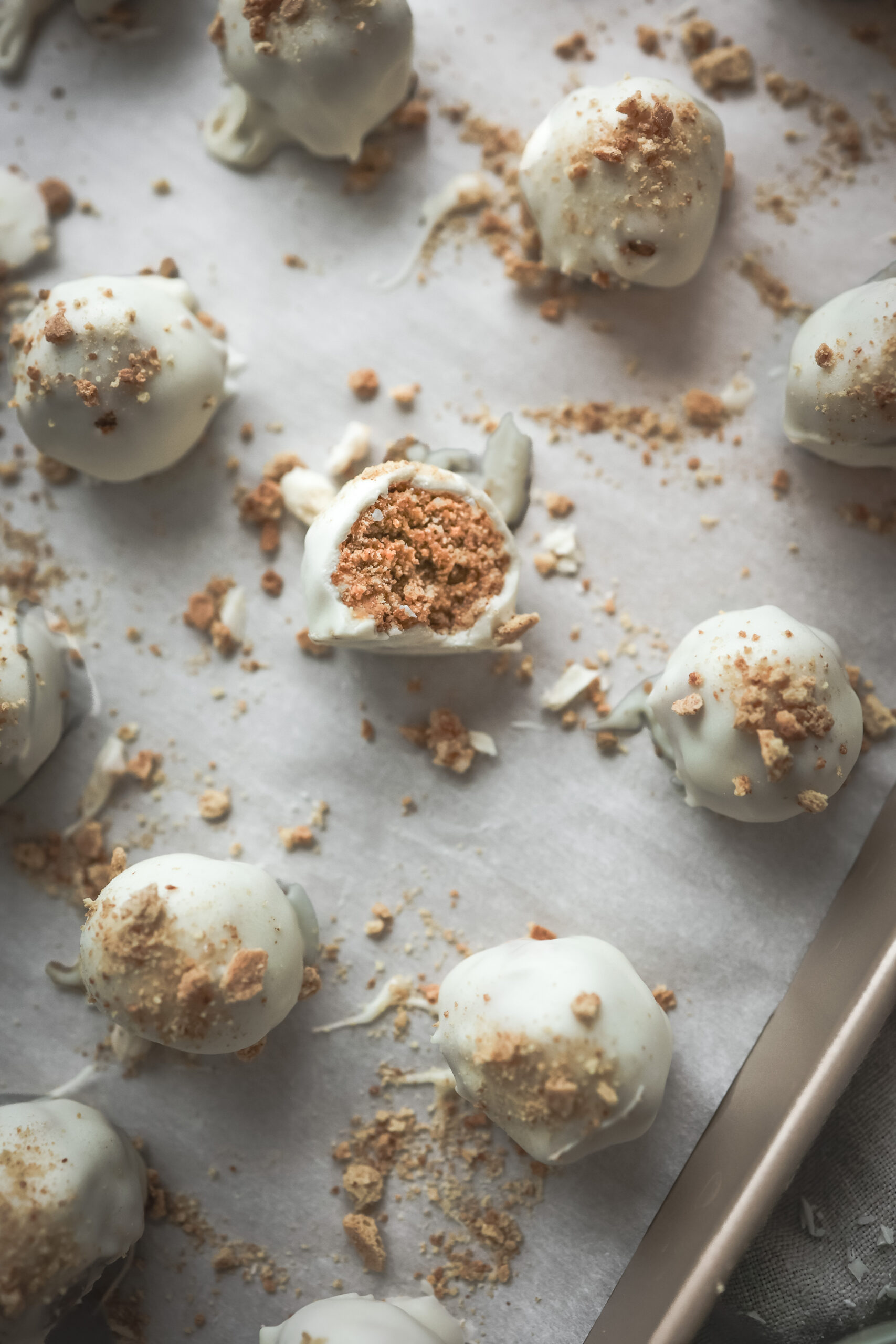 Overhead shot of a tray of pumpkin spice truffles covered in white chocolate