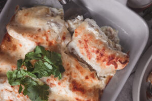 Sour Cream Enchiladas filled with chicken, green chiles, a creamy sauce and lots of cheese