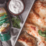 Sour Cream Enchiladas filled with chicken, green chiles, a creamy sauce and lots of cheese