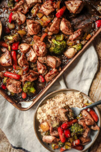 Easy sheet pan dinner served over white rice
