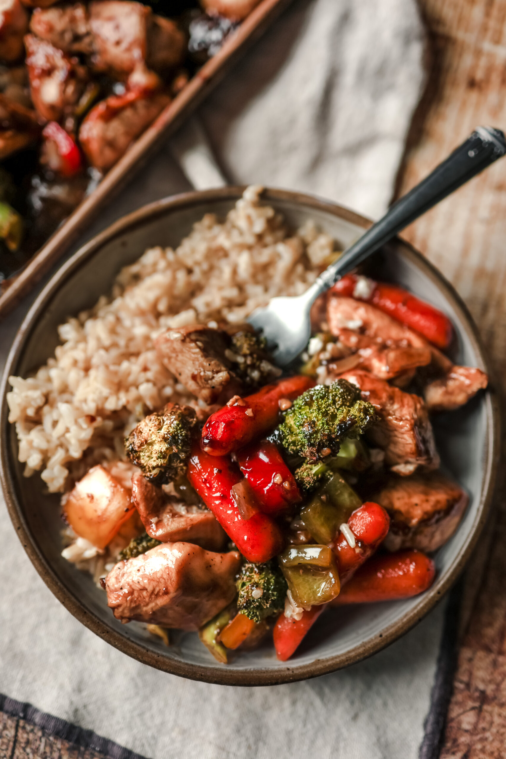Easy sheet pan dinner served over white rice
