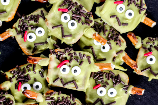 Make spooky and fun Frankenstein Pretzels for Halloween! Easy chocolate-dipped pretzel with candy eyes and silly monster faces kids will love.