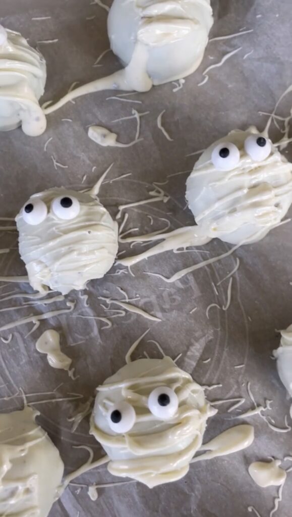 Mummy Oreo Truffle Balls made with Oreos, cream cheese, and white chocolate.