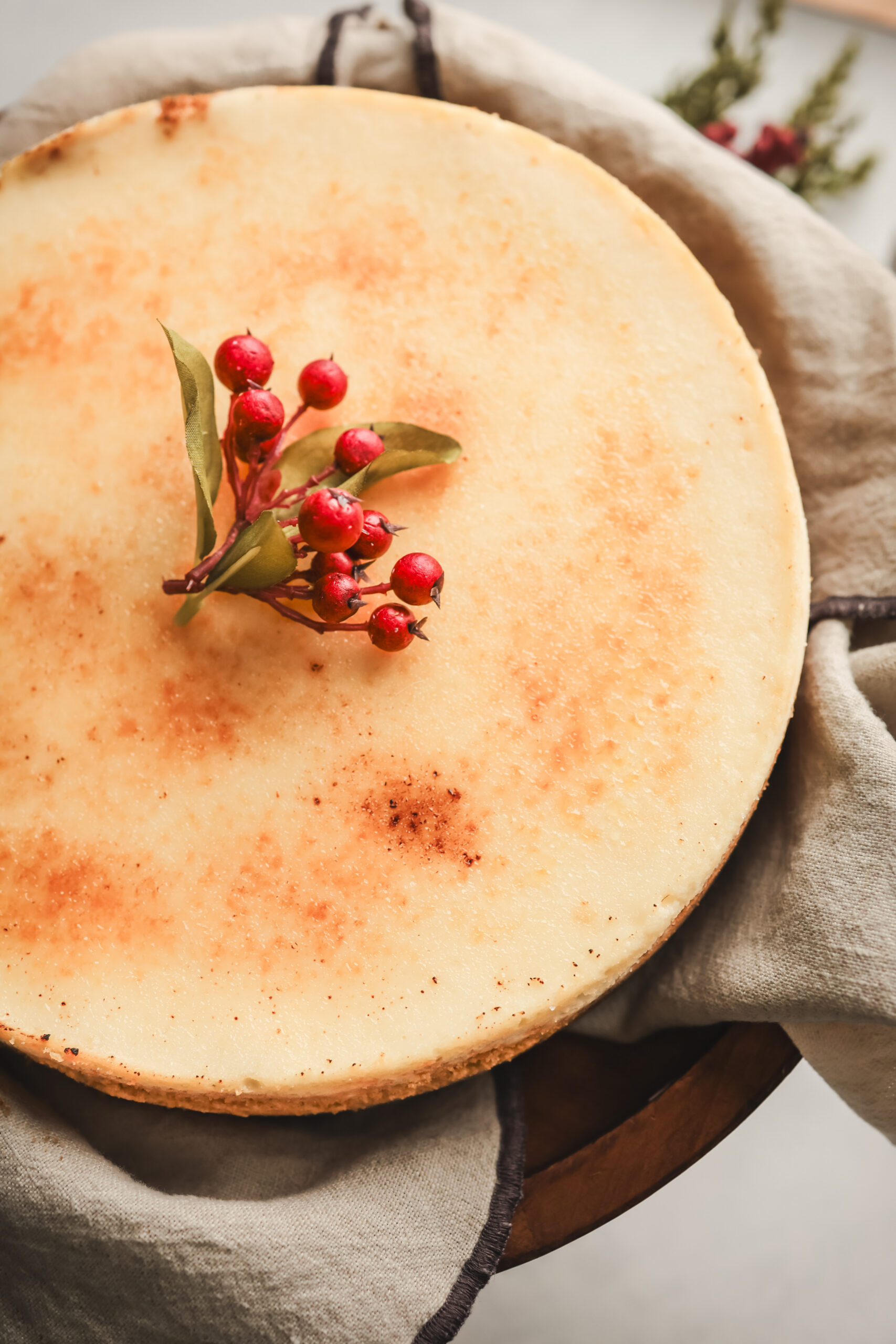 Overhead look at a creme brulee cheesecake with a toasted sugar top