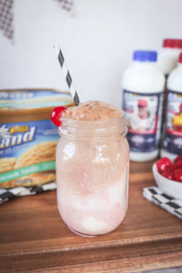 Straight on shot of a cherry cola ice cream float