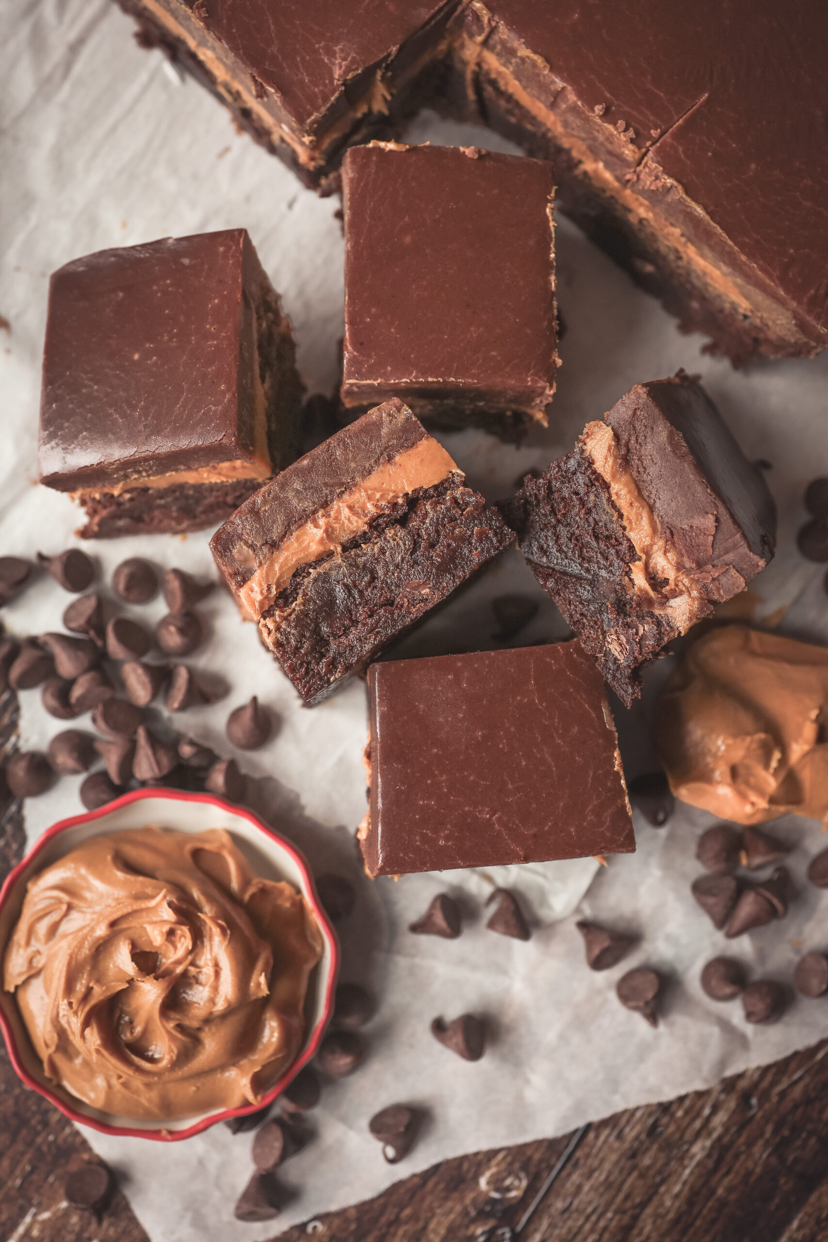 Layered peanut butter brownies with rich chocolate frosting on top