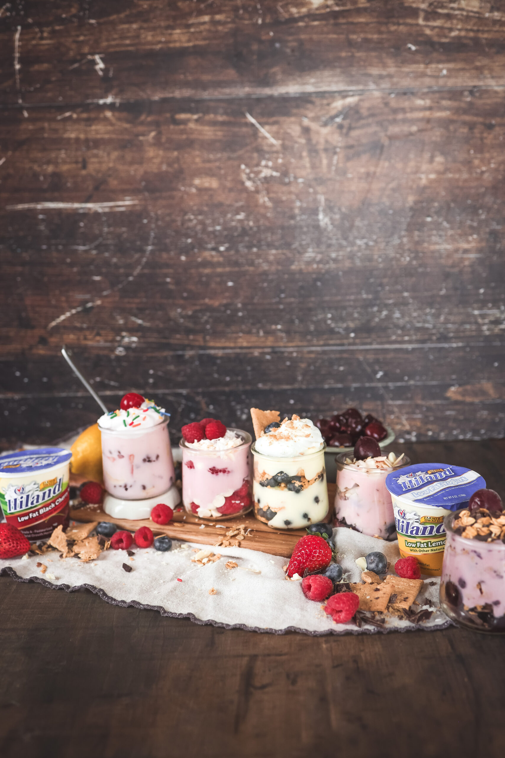 Easy yogurt parfait ideas with fruit, chocolate, and granola in five different flavor combinations