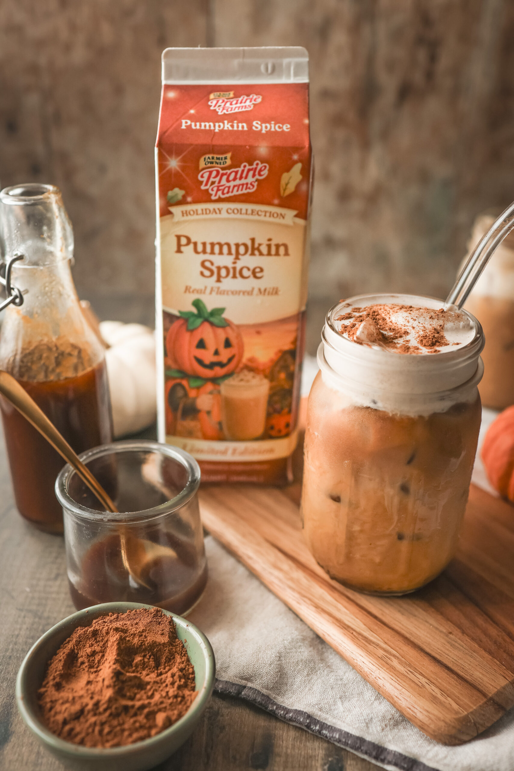 Iced Pumpkin Spice Latte topped with creamy Pumpkin Spice Cold Foam made with Prairie Farms Pumpkin Spice Milk.