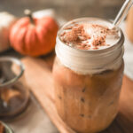 Iced Pumpkin Spice Latte topped with creamy Pumpkin Spice Cold Foam made with Prairie Farms Pumpkin Spice Milk.