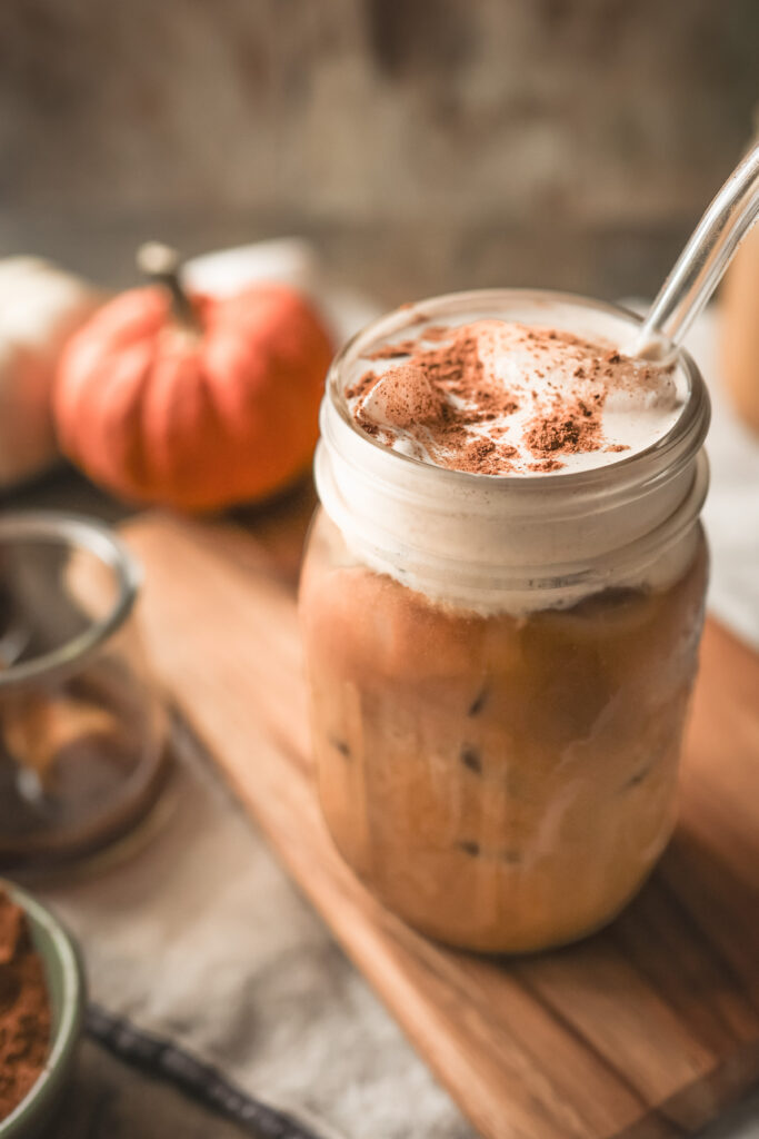 Iced Pumpkin Spice Latte topped with creamy Pumpkin Spice Cold Foam made with Prairie Farms Pumpkin Spice Milk.