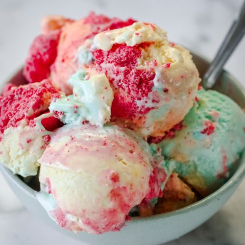 Overhead view of a bowl of rainbow colored ice cream