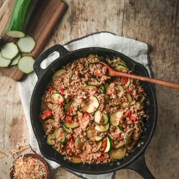 Overhead view of a skillet filled with the Zucchini and Sausage Mixture